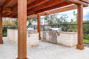 Outdoor entertainment area with trellis-shaded kitchen
